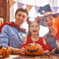 A family on Halloween with painted pumpkins